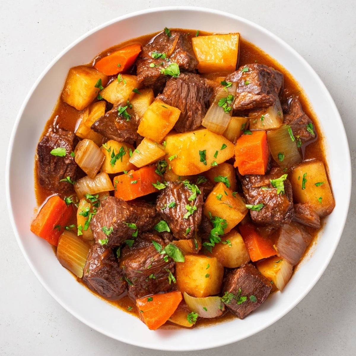 Beef Stew with Root Vegetables, garnished with fresh parsley, ready to serve alongside crusty bread for a cozy meal.