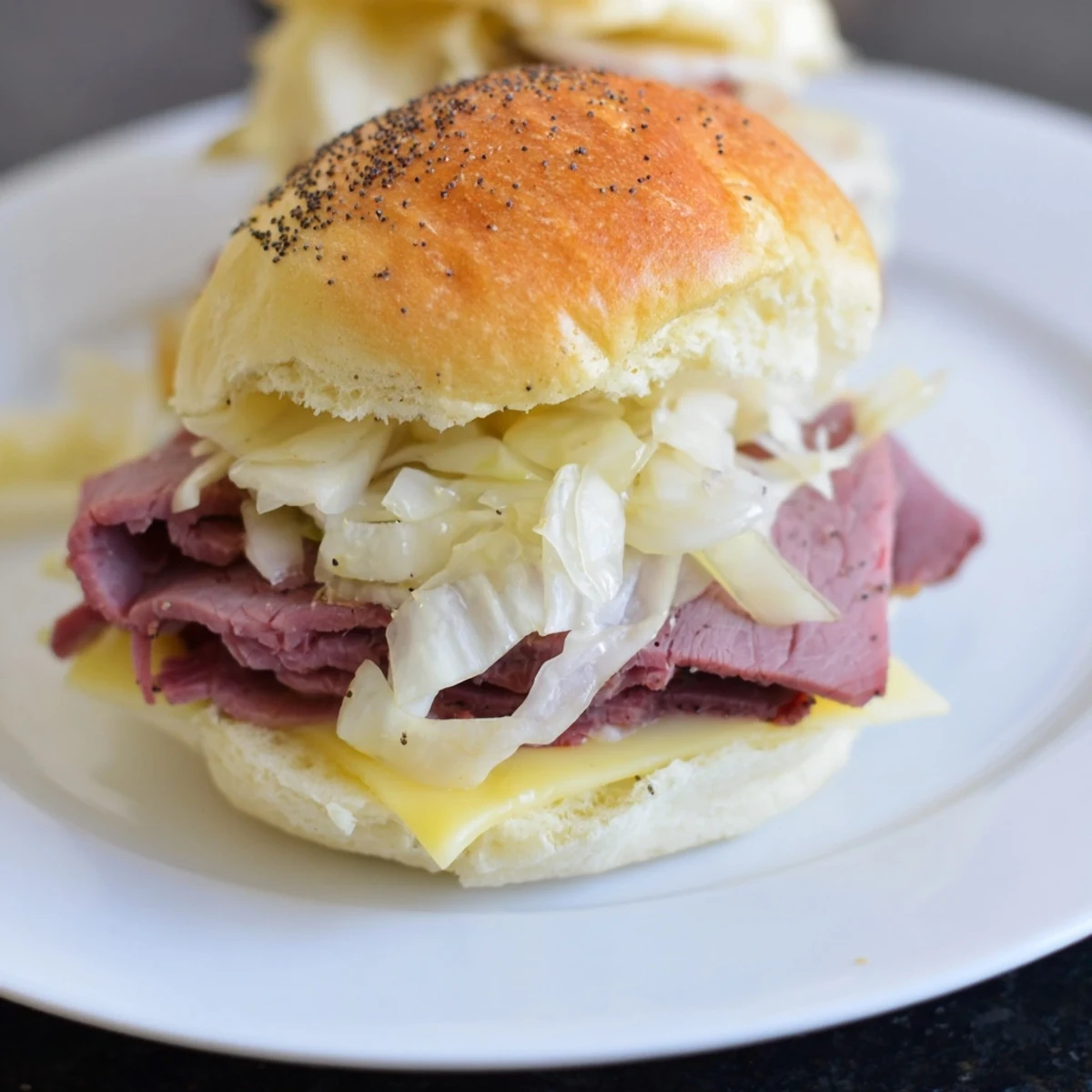 A close-up of warm Corned Beef Sliders with Mustard and shredded cabbage, ready to be served for game day.  