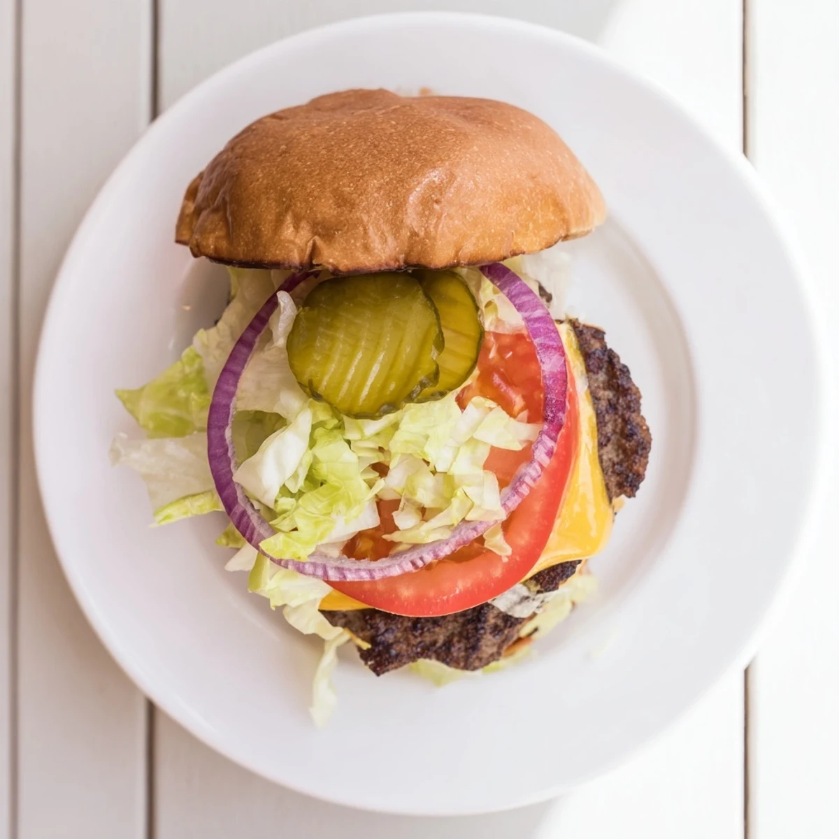 Juicy American smash burger topped with fresh lettuce tomato and tangy pickles