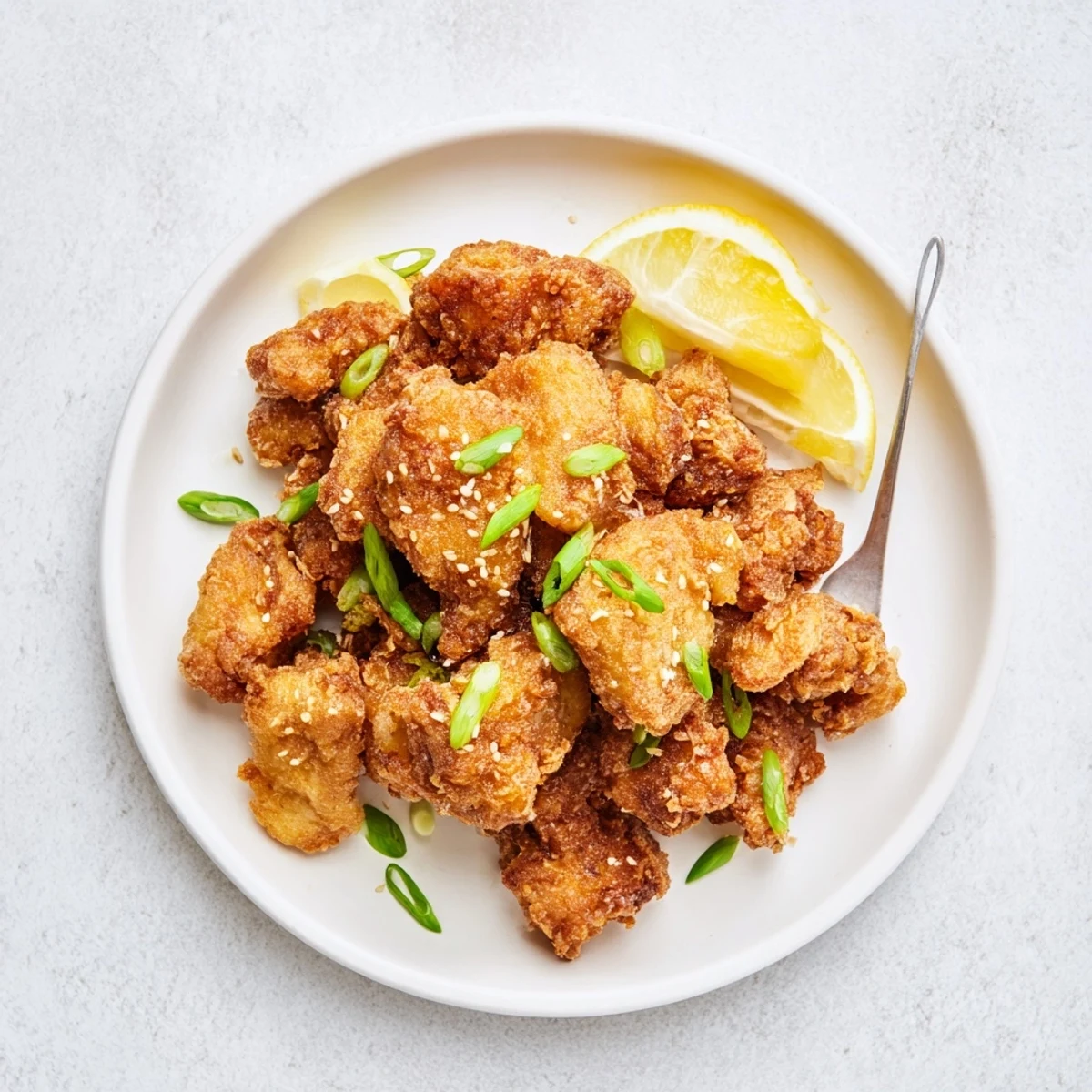 Crispy fried chicken thighs coated in sweet rice flour batter, served with steamed white rice and pickled vegetables