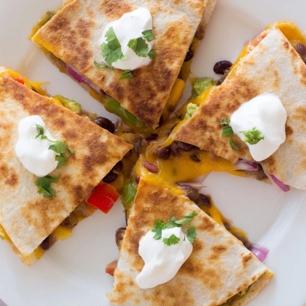 Sizzling skillet quesadillas with gooey melted cheese and colorful bell pepper fillings ready to serve