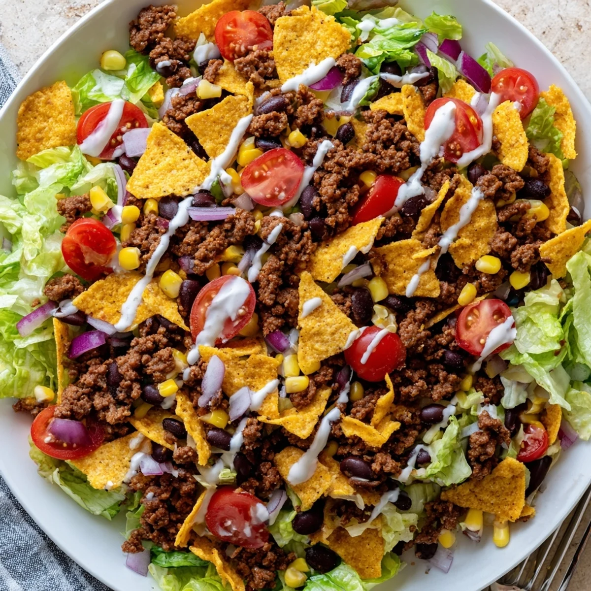 Simple Doritos Taco Salad with seasoned beef, crunchy chips, and creamy ranch