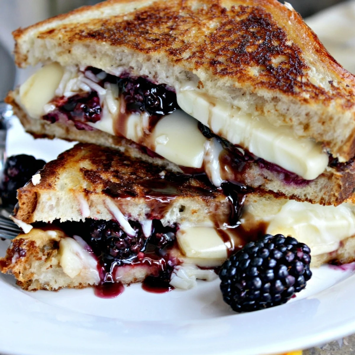 Toasted golden slices, melty cheddar and basil served as Balsamic Blackberry Bliss Grilled Cheese