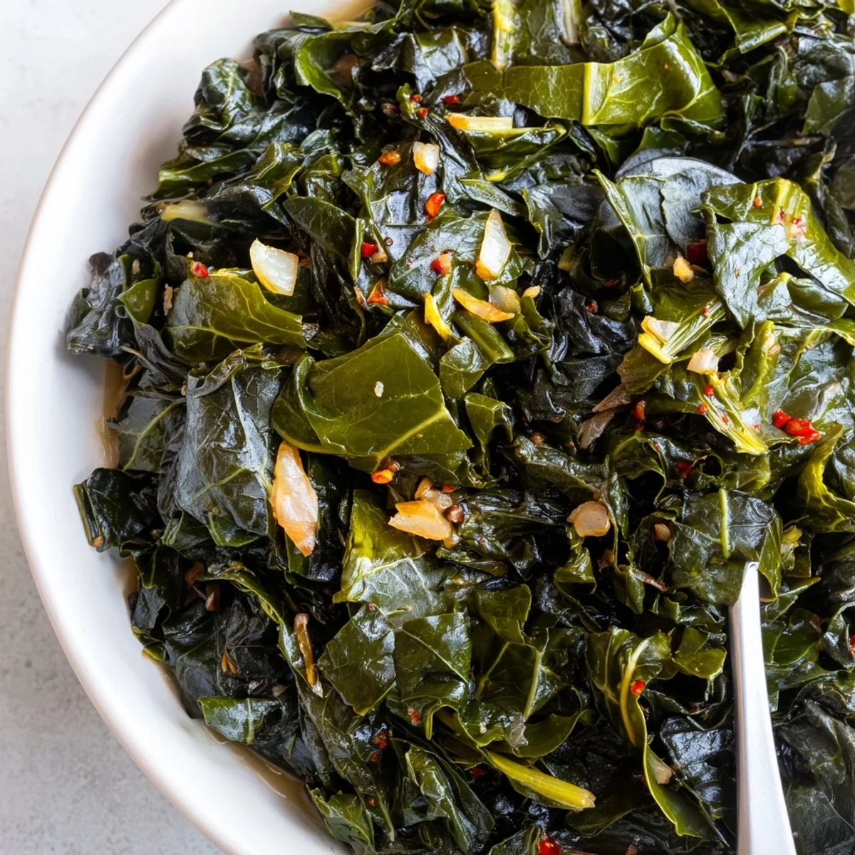 Savory, tender Collard Greens simmered in chicken broth, ready to spoon