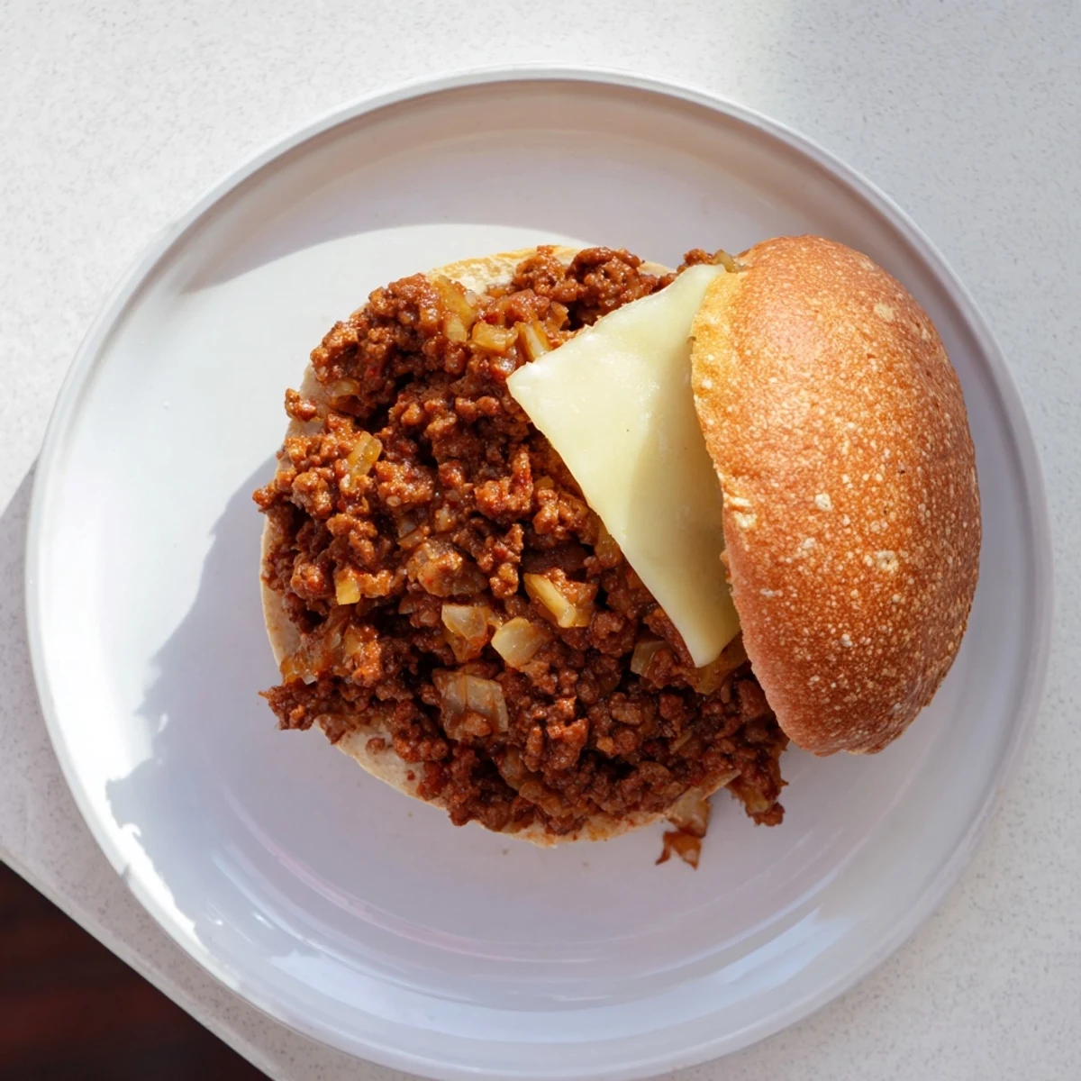 Golden caramelized onions and melted provolone atop these savory French Onion Beef Sloppy Joes on toasted buns