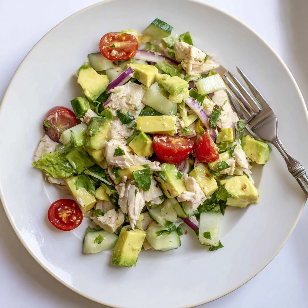 Chunky Avocado Chicken Salad with tender bites, diced cucumber, cilantro aroma