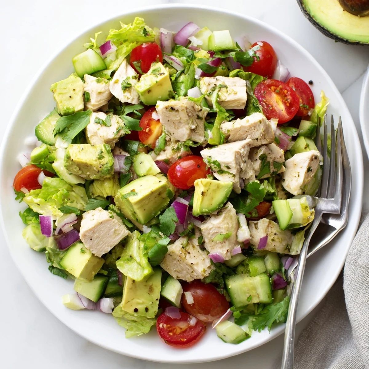 Zesty Avocado Chicken Salad served in lettuce wraps, bright lime and garlic
