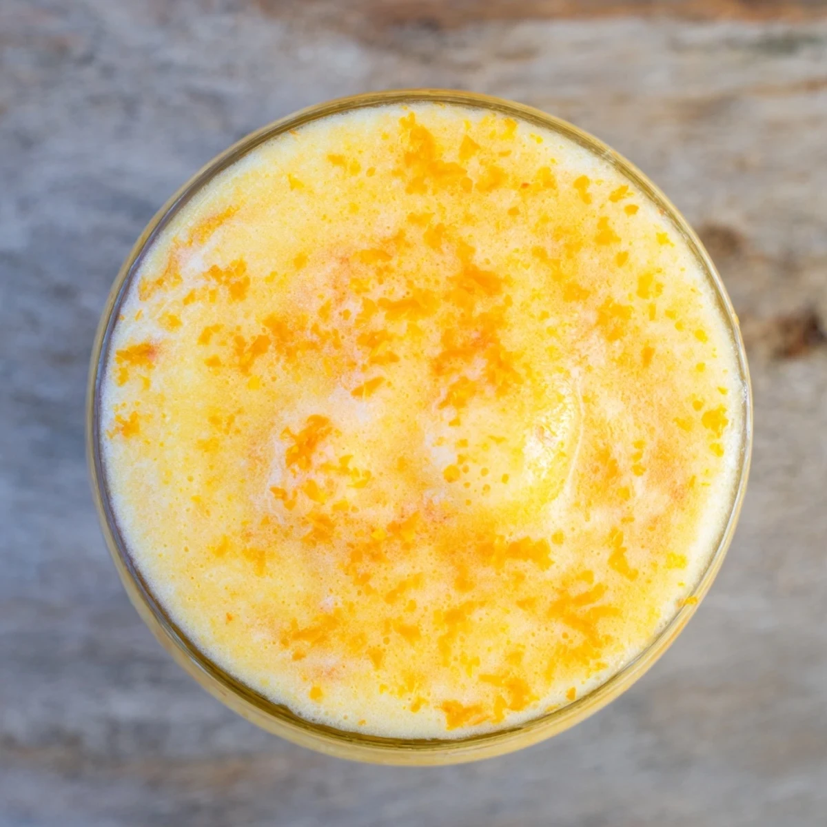 Refreshing frozen orange cream beverage swirling with citrus brightness in chilled mason jar