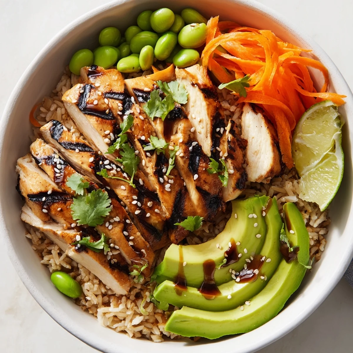 Juicy grilled chicken served over brown rice in a vibrant Asian inspired chicken power bowl