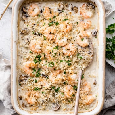 Creamy baked shrimp mushroom casserole featuring tender seafood and earthy sliced mushrooms in bubbling sauce